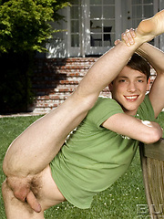 Cute twink posing on a lawn